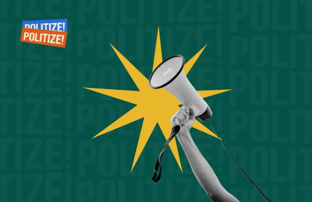 uma mão segurando um megafone
