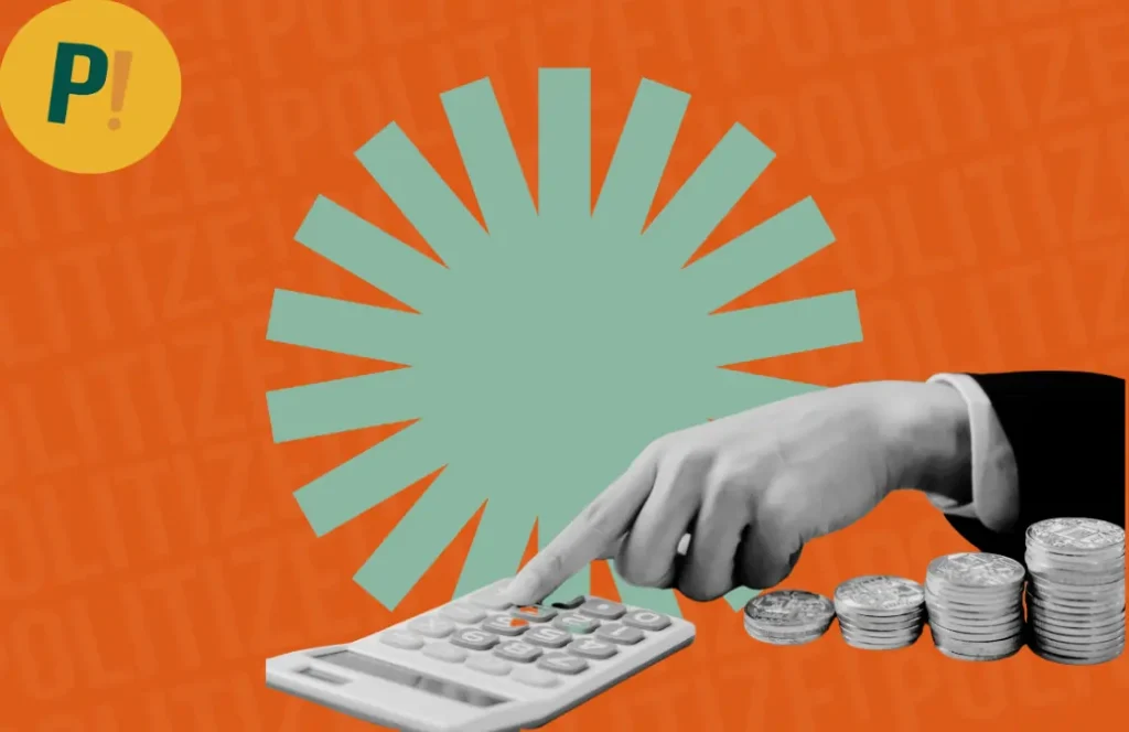 Imagem de uma mão mexendo em calculadora e moedas empilhadas ao lado