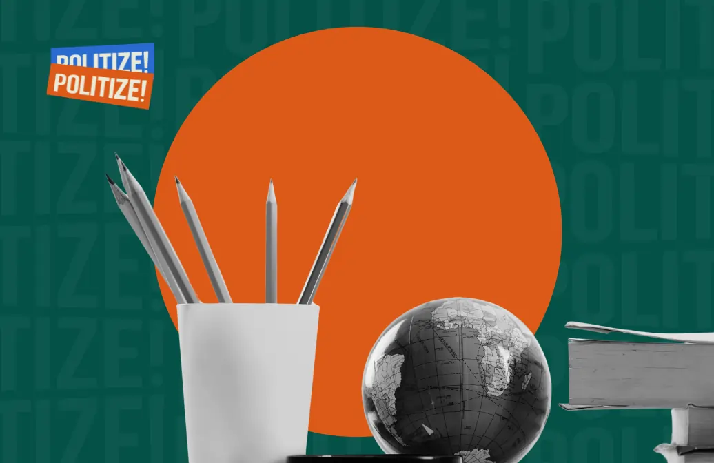 pote com lápis, um globo terrestre e livros empilhados